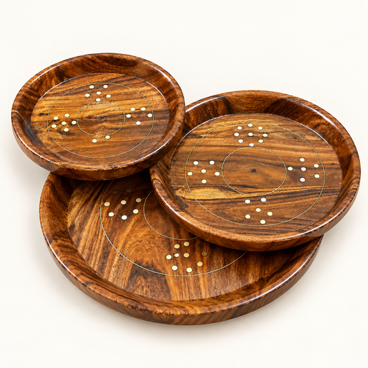 Three round wooden serving trays stacked together with decorative mosaic detailing