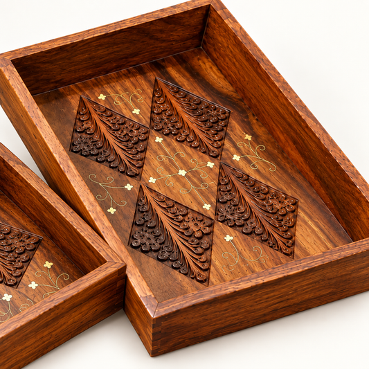 Stacked rectangular Sheesham wood serving trays with detailed carved geometric motifs